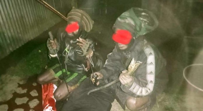 Dua orang KKB masing-masing Ham Dumupa (25) dan Amoye Pigai alias Martinus Pigai sempat berfoto usai membunuh Josep Agus Lepa di Perumahan Pemda Kabupaten Dogiyai pada 6 Mei 2025 lalu