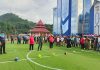 Caption : Wakil Ketua III DPR Papua, Supriadi Laling dengan diikuti sejumlah anggota DPR Papua, Sekwan DPR Papua, Forkopimda Provinsi Papua, saat menendang bola sebagai tanda pembukaan turnamen Futsal Ketua DPR Papua Cup IV 2025