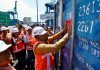 Wakil Gubernur Papua Dr. Aryoko A.F. Rumaropen, S.P., M.Eng. saat menempelkan sticker karantina pada pelepasan pengiriman kopra di Pelabuhan Jayapura, Selasa (11/8)